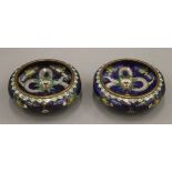 A fine quality pair of 19th century Chinese blue ground cloisonne shallow bowls,