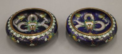 A fine quality pair of 19th century Chinese blue ground cloisonne shallow bowls,