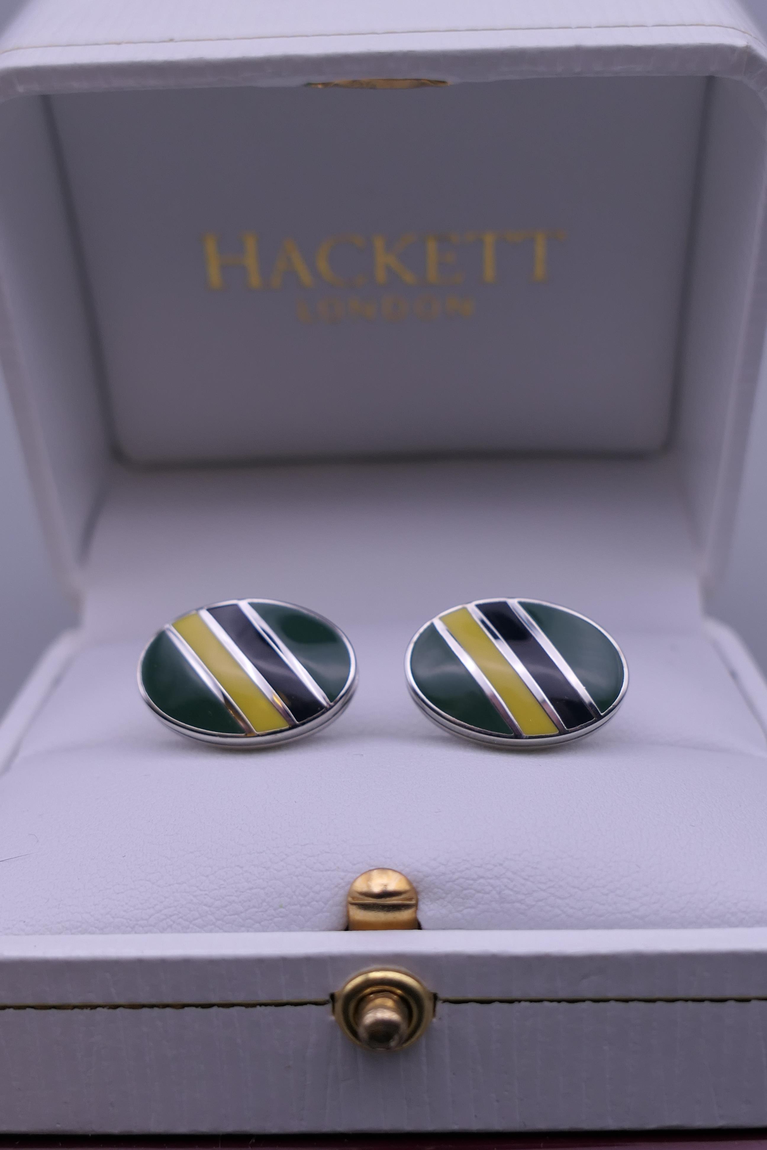 A pair of Hackett cufflinks.