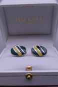 A pair of Hackett cufflinks.