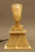 A 1930s Art Deco Egyptian Revival alabaster lamp modelled on an ancient image of Queen Nefertiti,