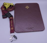A Patek Philippe mouse pad and key holder.
