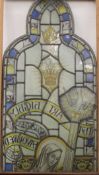 A Victorian two section lead glazed stained glass window depicting The Virgin Mary,