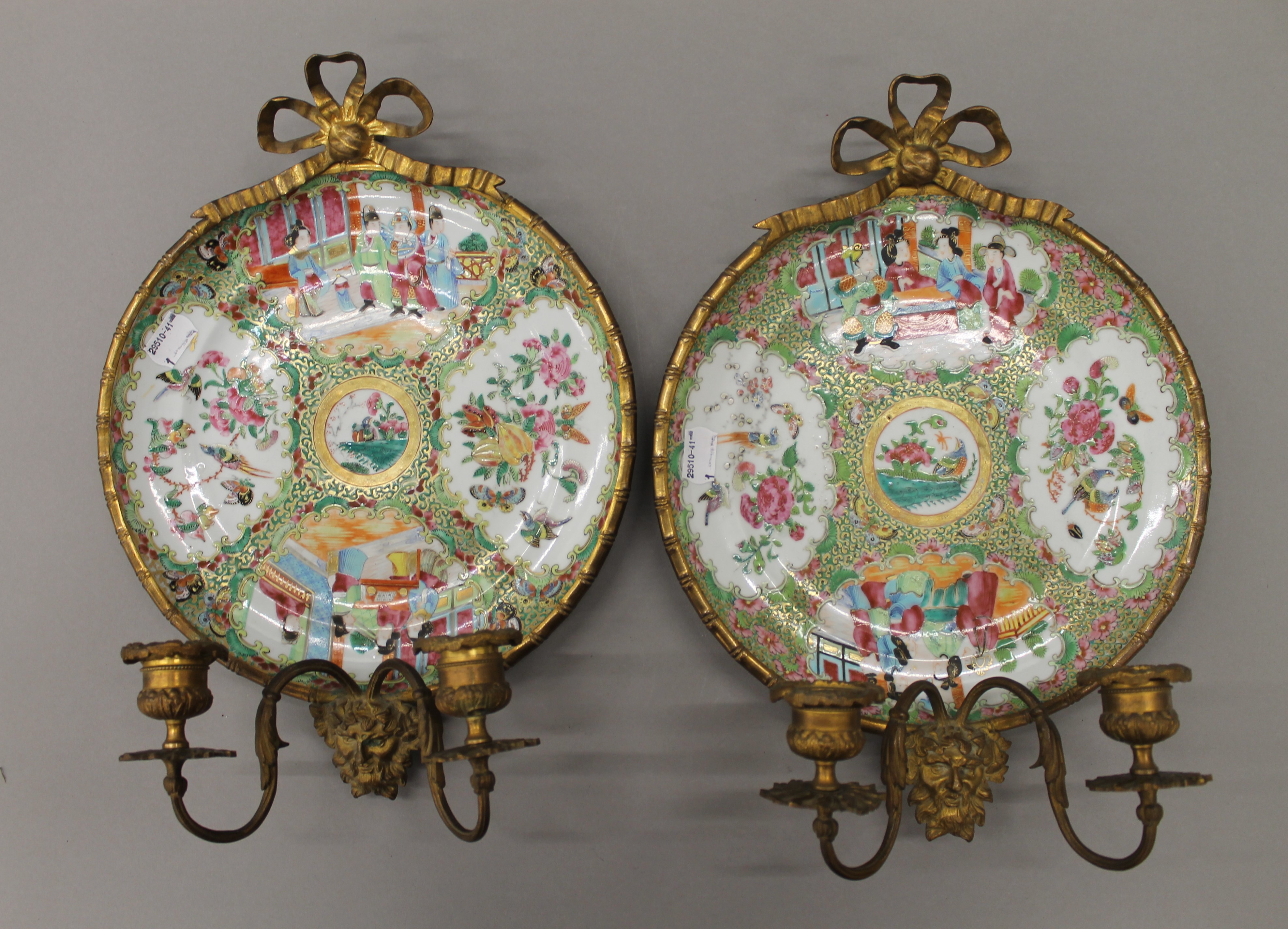 A pair of 19th century ormolu mounted Canton famille rose plates,