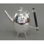 A Christopher Dresser style teapot. 17 cm high.