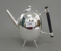 A Christopher Dresser style teapot. 17 cm high.