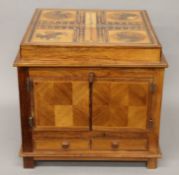 A fully fitted marquetry inlaid chess, draughts and games box. 37 cm wide.
