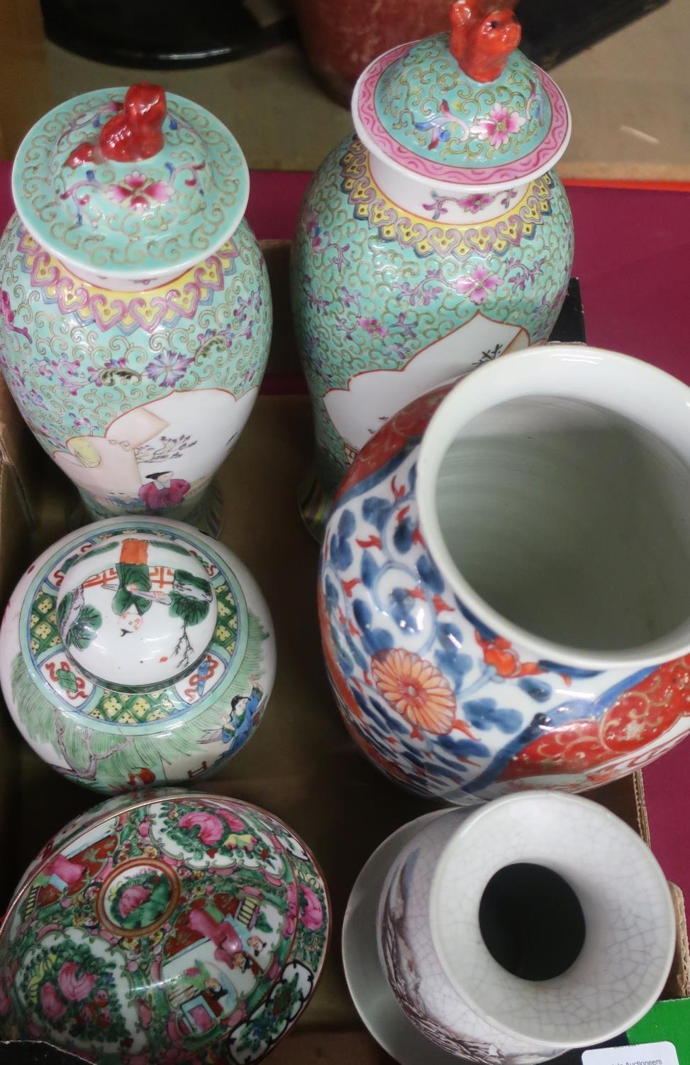 Pair of 20th C Chinese lidded vases and covers, polychrome decorated, panels inset with garden