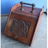 Victorian walnut slope front coal box with carved and panelled door with tin liner