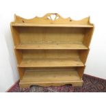 Waxed pine graduated four tier open bookcase, W105cm D29cm H114cm