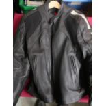 Dainese XGE leather motor cycle jacket, pair of Dainese black leather motorcycle trousers and an