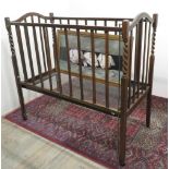 20th C Oak child's cot with barley twist decoration W61cm H110cm L120cm, and a humorous print of