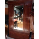 Edwardian mahogany inlaid wardrobe with single mirror door above single drawer (W131cm x D52cm x