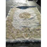 Large wool carpet, with floral central medallion and spandrels on a cream ground (420cm x 300cm)