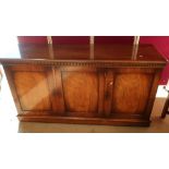 Geo. III style mahogany sideboard, with frieze above three panel doors on a plinth base L158cm W46cm