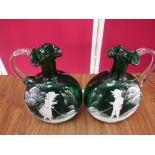 Pair of green glass ewers, Mary Gregory style decorated with fishing figures, clear glass handles