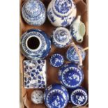 Pair of Japanese blue and white tea caddies and covers decorated with prunus , two other smaller,