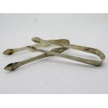 Pair of Georgian silver hallmarked bright cut sugar tongs by Peter and Ann Bateman, and a similar