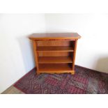 Modern yew wood style two tier open bookcase, W102 D38 H97cm, and two small open book cases, W44cm