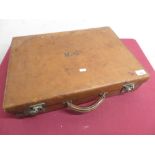 20th C tan leather dressing case with fitted green watermarked silk interior