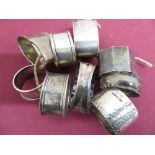 Collection of nine Victorian and later hallmarked silver napkin rings, variously decorated,