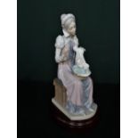 Lladro figurine 5126 ''Sewing a Trousseau'' including base, H30cm.