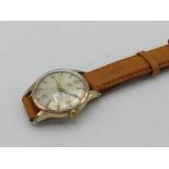 Omega hand wound wristwatch. 9ct gold case on leather strap. Case back stamped Omega Watch Co. 9ct