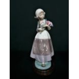 Lladro figurine 5065 "Ingrid With Flowers" H25cm, including base.
