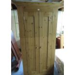 Solid pine wardrobe, moulded cornice above a pair of panelled doors W104cm H198cm D63cm