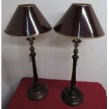 Pair of Geo. lll style mahogany table lamps with turned tapering columns on circular bases, brass