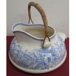 A Victorian blue and white transfer print toilet jug, with wicker swing handle D30cm