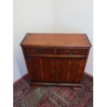 Yew style side cabinet with two drawers above pair of doors on bracket feet W76cm D28cm H77cm