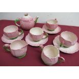 Carlton Ware Pink Buttercup tea service, comprising four cups and saucers, teapot and cover, sugar