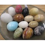 1970's Art glass bowl containing a collection of carved and polished hardstone eggs