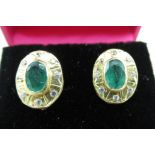 Pair of 18ct gold emerald and diamond set oval earrings, stamped 750, boxed (2)
