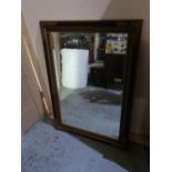 Rectangular bevelled edge wall mirror in gilt and moulded frame W108cm H77cm