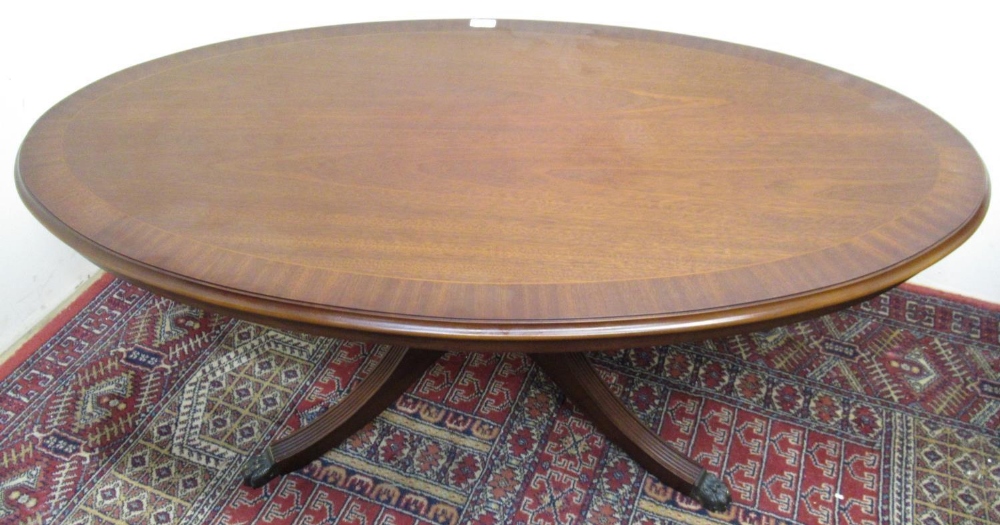 Strongbow furniture cross banded mahogany oval coffee table on four reeded outsplayed supports