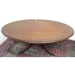 Strongbow furniture cross banded mahogany oval coffee table on four reeded outsplayed supports