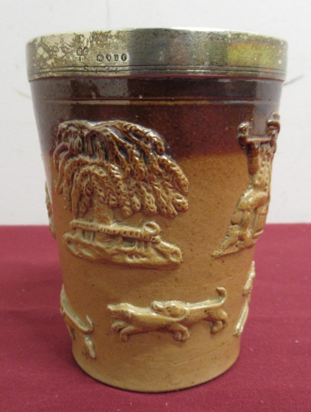 Doulton Lambeth type glazed stoneware beaker with relief moulded country scenes and hallmarked