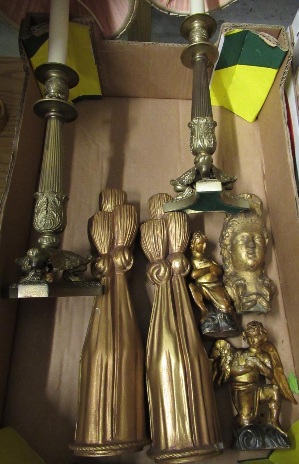 Pair of Regency gilt metal table lamps with acanthus and fluted supports on tri form bases, with