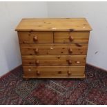 Modern pine chest of two short above three long drawers, turned handles and feet W82cm D40cm H74cm