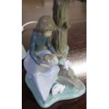 Nao table lamp modelled as girl with three rabbits seated by a tree, with shade H34cm