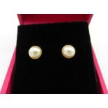 Pair of freshwater pearl and silver ear studs, boxed (2)