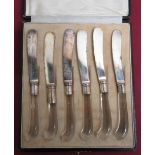 Set of six tea knives with pistol grip glass handles and white metal collars by T. Good & Co,
