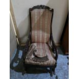 Victorian mahogany framed rocking chair with carved top rail and scroll arms, beech framed