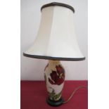 Moorcroft table lamp, ovoid body decorated with a red poppy with green leafage on a cream ground,