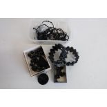 Pair of jet earrings, two jet bracelets, other jet necklace and bracelet parts, in one box