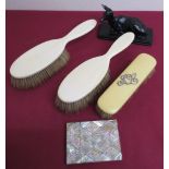 Victorian mother of pearl card case, pair of ivory hairbrushes, ivorine hairbrush, and a resin model