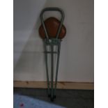 Vintage green metal framed folding shooting stick, a child's Lloyd Loom style wicker chair and a