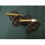 Pair of miniature brass and cast cannons L20cm